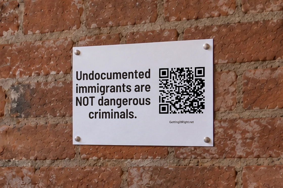 Undocumented immigrants are NOT dangerous criminals. — A printed page displayed by a café doorway.